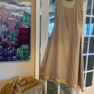 NEW!!!  Never worn.  Sleeveless tunic or dress. Fully lined.  46” length.